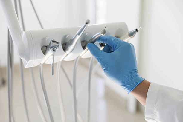 Professional Invisalign Clear Aligners technician working in Fulton, TX